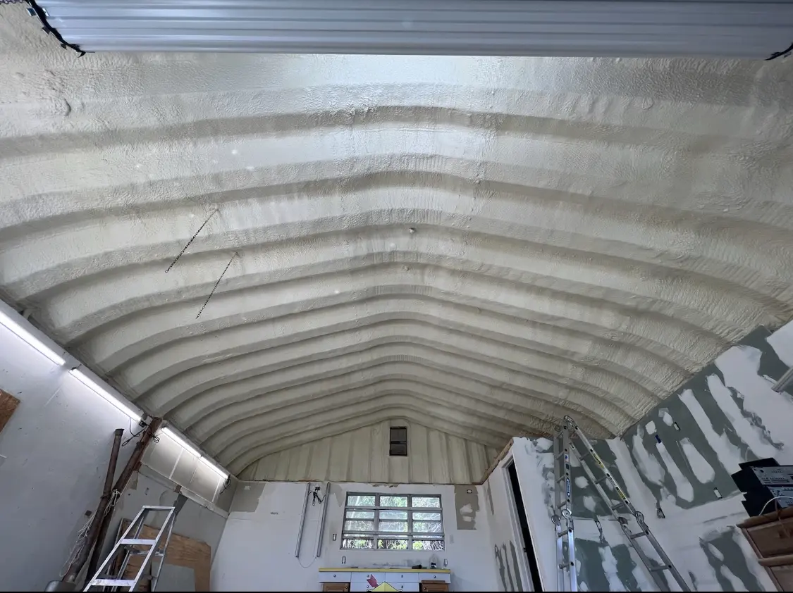 Spray polyurethane foam applied to the underside of a metal roof deck in Hubbard